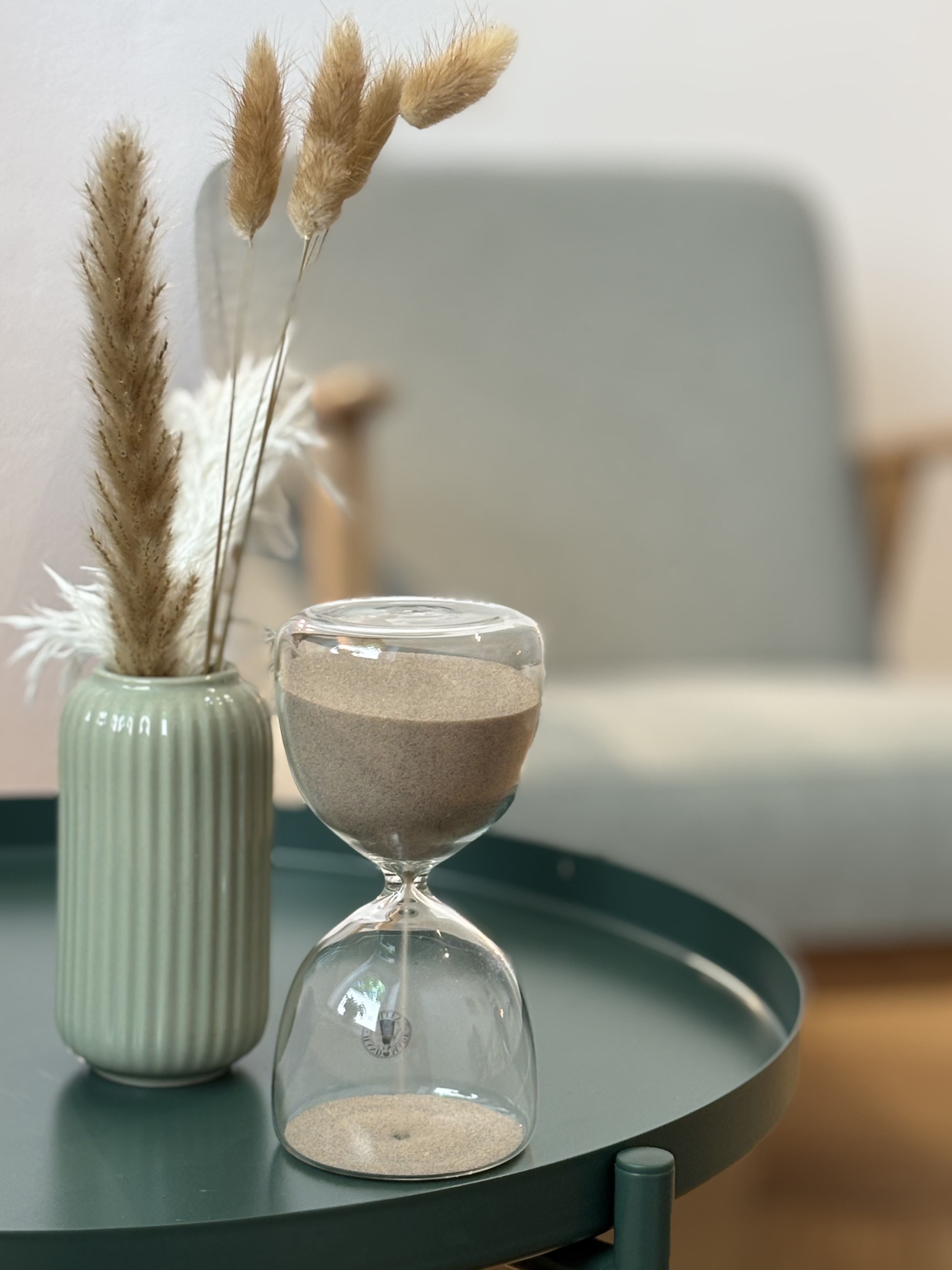Eine Sanduhr symbolisiert die Dauer der Therapie.
